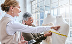 Fashion, designer and measure with business people and mannequin for planning, ecommerce and manufacturing. Management, tablet and tape with women in factory studio for retail and online shopping 