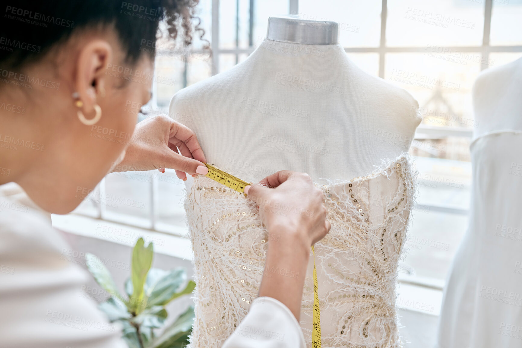 Buy stock photo Fashion, designer and woman measuring dress on mannequin. Small business, boutique and female seamstress or tailor with tape to measure clothing, fabric or textile on dummy in workshop or studio.