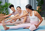 Friends, pregnant yoga and leg stretch on floor for health, wellness and exercise while bond and relax. Pregnant, female and group stretching for pilates, workout and flexible, cardio in living room