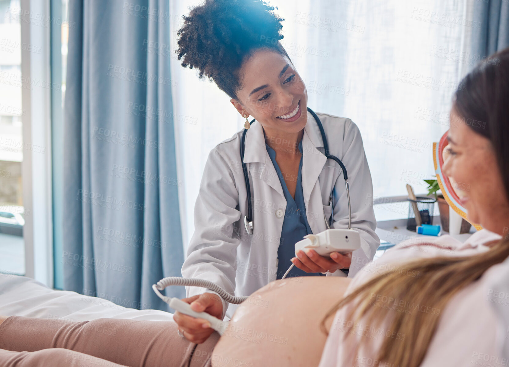 Buy stock photo Woman, pregnancy and doctor, ultrasound at clinic with happiness, excited and family planning for future. Black woman medic, pregnant woman and consulting with medical tech on stomach for sonogram