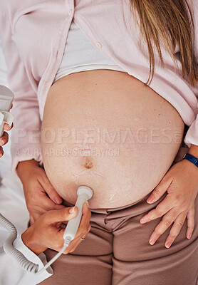 Buy stock photo Stomach, doctor hands and ultrasound for pregnancy in hospital for health, wellness and family planning for future. Medic hand, pregnant woman and consulting with medical tech on abdomen for sonogram