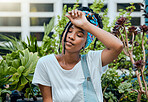 Tired, gardener or black woman with fatigue, burnout or stress after cleaning dirty plants or flowers. Gardening, sweating or exhausted girl resting after working on environmental maintenance job