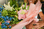 Bouquet, spring and woman with flowers for a present at a shop for growth, gift or gardening. Floral, entrepreneurship and florist with smile for plants, nature and ecology at a small business