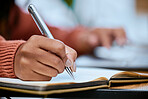 Student, writing and zoom of hand with notebook for studying, learning and notes in academic class. University, college and closeup of hands with pen to write schedule information, planning and ideas