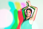 Portrait, dance or kaleidoscope and a ballet woman in studio on a white background with a colorful backdrop. Art, music and performance with a female dancer or ballerina on a multicolor wall