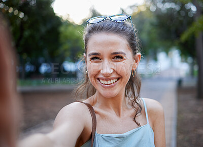 Buy stock photo Selfie, young woman and casual in park, walking and smile for fun, balance and happiness. Portrait, female and lady with joy, summer and chilling outdoor, cheerful and freedom on break and weekend