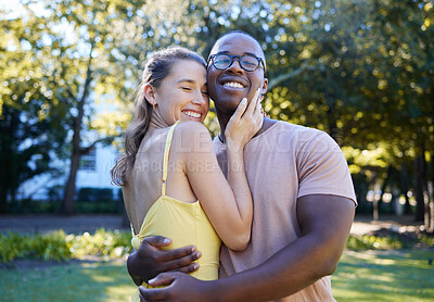 Buy stock photo Love, interracial and couple hug in park, bonding and happiness for romance, wellness and quality time together. Romantic, black man and woman embrace, dating and loving for relationship and smile