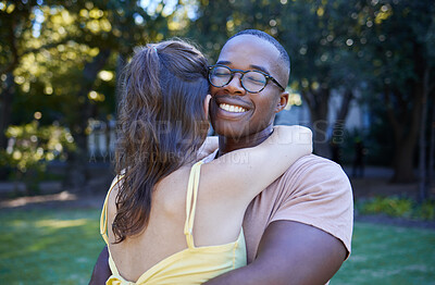 Buy stock photo Black man, interracial relationship and hug on park lawn with love, care and bonding for quality time, reunion and happiness. Multicultural embrace, happy couple and outdoor diversity on grass field