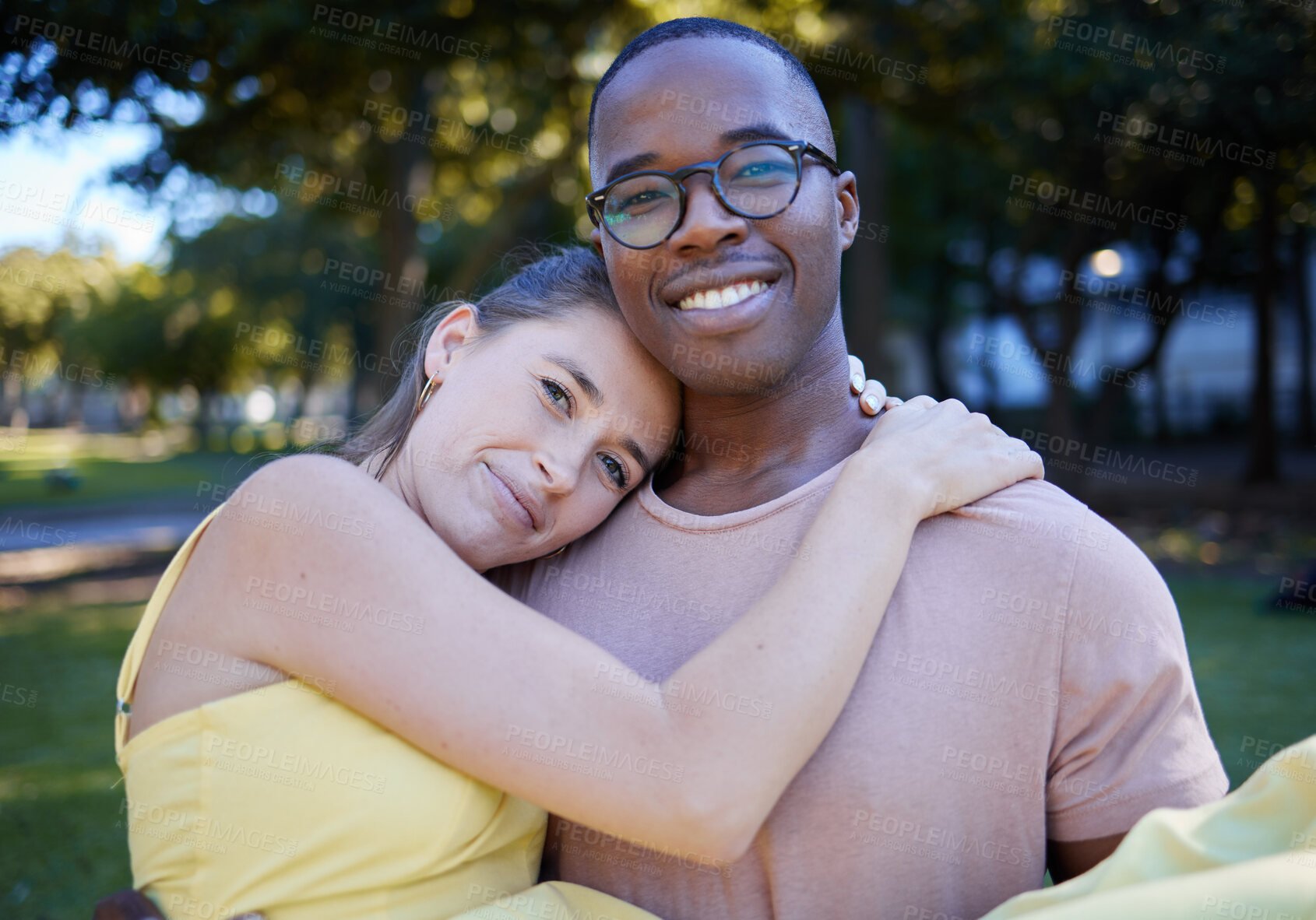 Buy stock photo Couple hug in portrait with date outdoor, nature and happy people in interracial relationship with commitment in park. Love, trust and support with black man and woman, smile  on face and fresh air