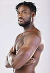 Confident, muscular and portrait of a black man with arms crossed isolated on a grey studio background. Fitness, health and African athlete with muscle, power and bodybuilding body on a backdrop