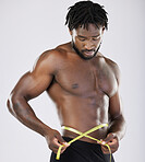 Tape, fitness and man body isolated on white background for lose weight, bodybuilder diet and training wellness. Bodybuilding, studio and sports black person measure his waist, stomach or muscle