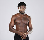 Fitness, black man and body portrait of sports person in studio for strong muscle and power. Health and wellness of a sexy male bodybuilder model with growth after exercise, workout and training