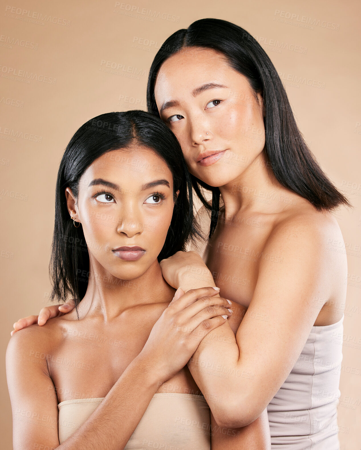 Buy stock photo Beauty, skincare and diversity women friends in studio for dermatology, makeup and cosmetics. Asian and black person together for skin glow, wellness spa facial and love of inclusion for foundation