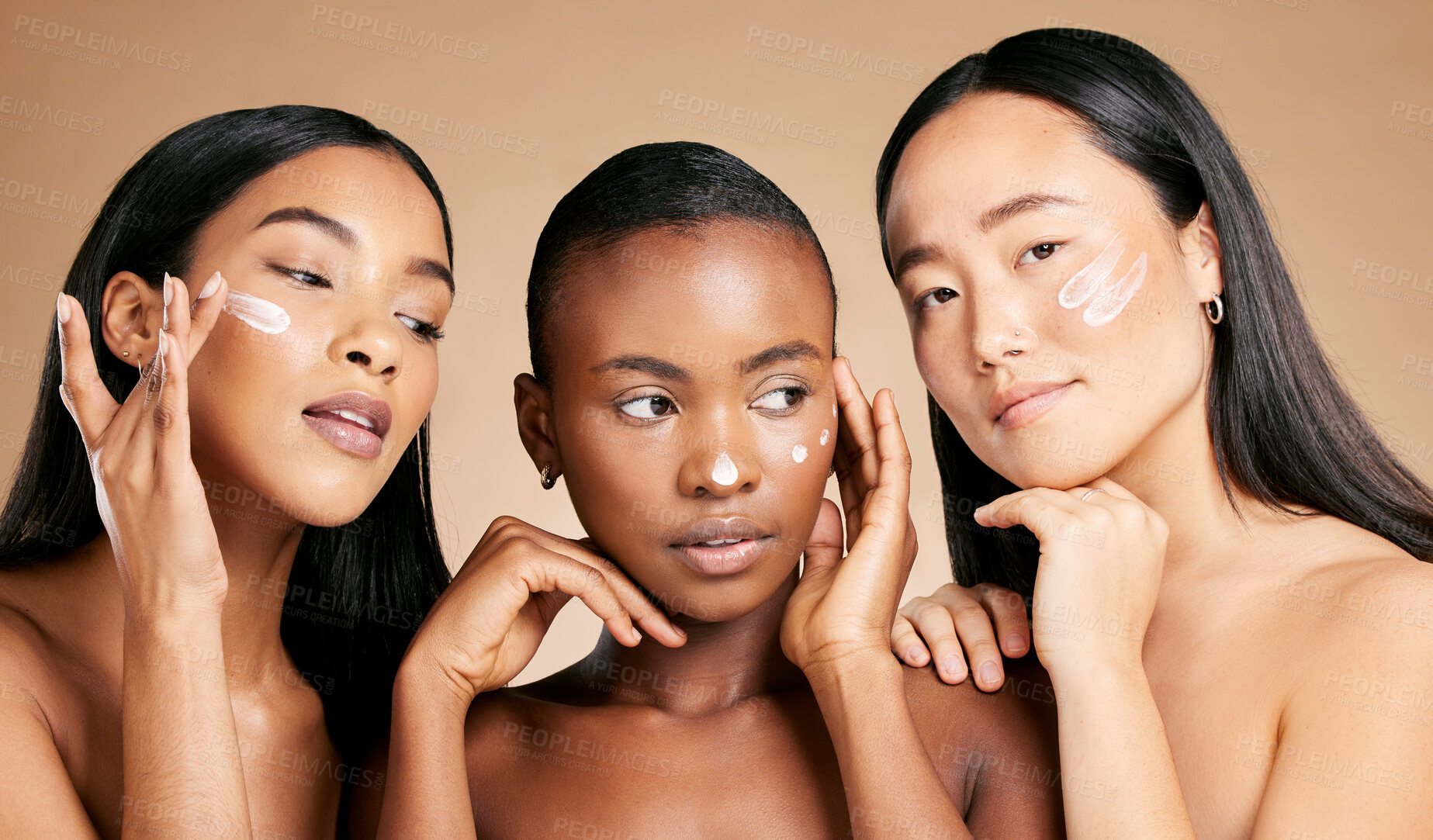 Buy stock photo Face cream, skincare and women in studio for wellness, grooming and hygiene against brown background. Friends, beauty and lotion for girl group with different, facial and skin product while isolated