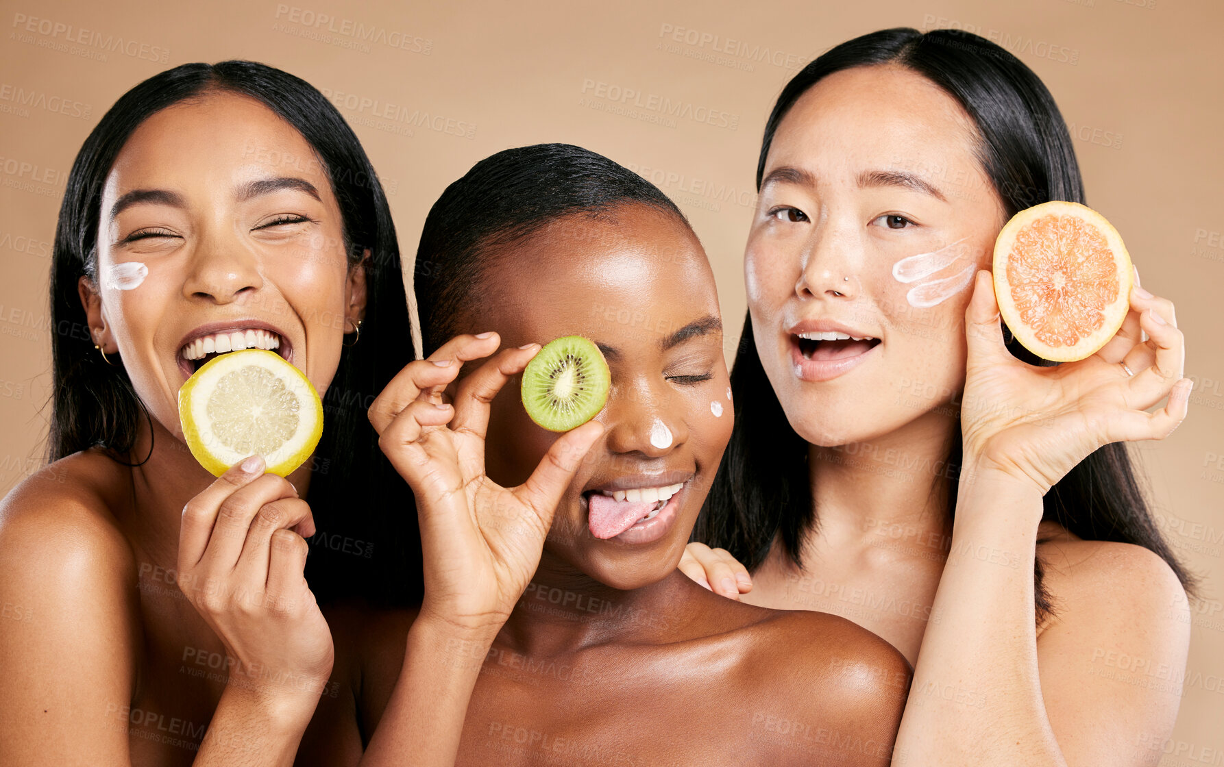 Buy stock photo Face, fruit and women in portrait with cream for facial care, beauty and natural cosmetics isolated on studio background. Sunscreen, vegan and different skin with skincare, moisturizer and playful