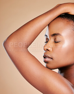 Buy stock photo Black woman, eyes closed and relax for skincare, cosmetic or facial treatment isolated against a brown studio background. African American female model face in satisfaction for self love or body care