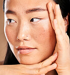 Closeup face, hand frame and asian woman in studio with skincare, skin glow or healthy cosmetics. Happy japanese model, cosmetic beauty and aesthetic with self care health, wellness or natural makeup