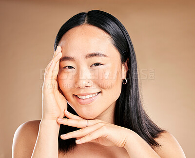 Buy stock photo Portrait, skincare and treatment with a model asian woman in studio on a beige background for natural beauty. Wellness, aesthetic or facial with an attractive young female posing to promote antiaging