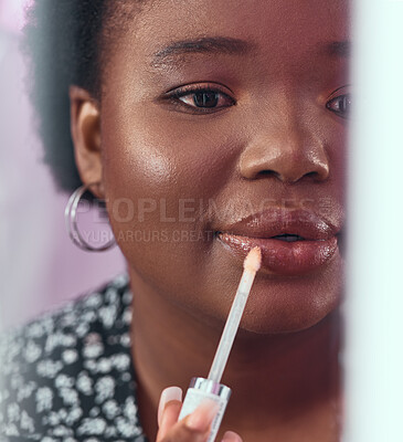 Buy stock photo Black woman, makeup and lipstick for beauty, cosmetics or glow and gloss for facial treatment in the bathroom. African American female applying cosmetic product to lips or mouth with stick brush