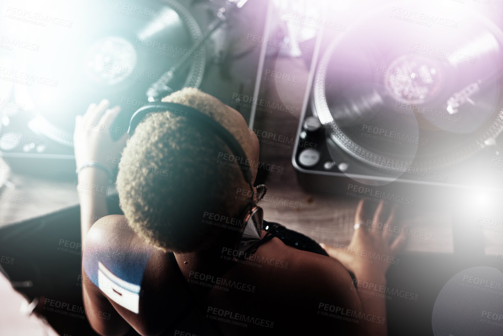 Buy stock photo Black woman, DJ and music for party, club or event in celebration, sound or energy with technology. African American female musician with turntable for disco, concert or audio track at nightclub