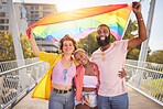 Portrait, rainbow and flag with a lgbt friends outdoor together for diversity, gay pride or freedom. Support, equality and human rights with a man and woman friend group standing outside for politics