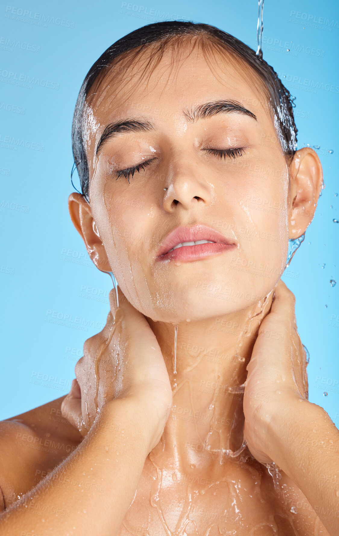 Buy stock photo Woman, shower water and face of a calm model ready for morning skincare and wellness. Blue background, studio and isolated female relax with peace from facial beauty cleaning and self care alone