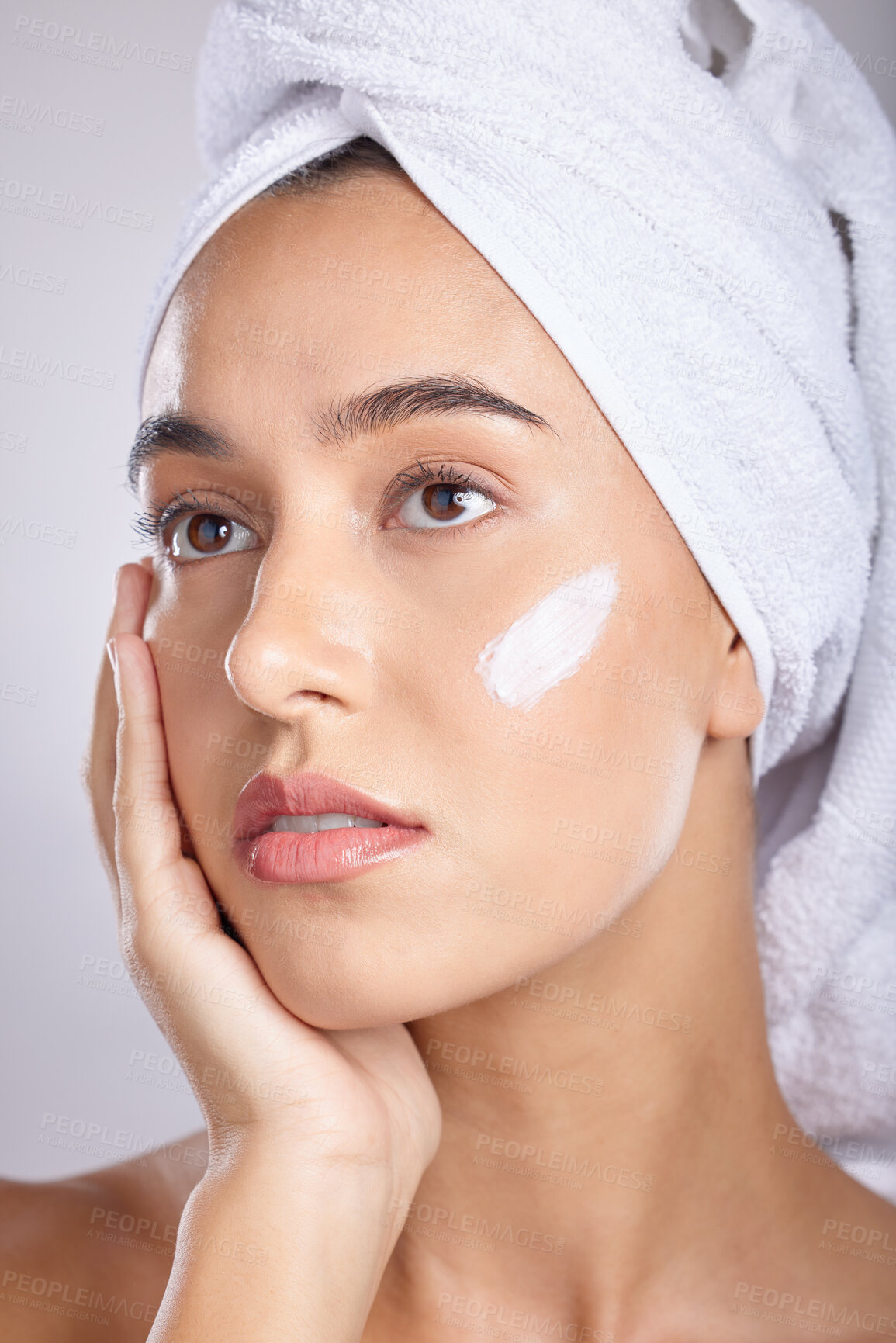 Buy stock photo Woman, head towel and cream for skincare, wellness and organic facial for face detox on grey studio background. Female, lady or makeup for natural beauty, confident and cosmetics for grooming routine