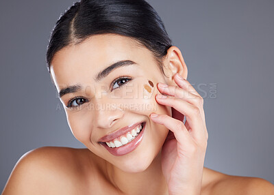 Buy stock photo Beauty, foundation test and portrait of woman with skincare product for self care, anti aging or wellness. Facial healthcare, spa salon and happy model face with makeup cosmetics on studio background