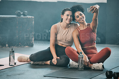 Buy stock photo Happy woman, friends and fitness with phone for selfie, moments or picture in workout exercise or training at gym. Sporty women with smile looking at smartphone for photo or healthy wellness together