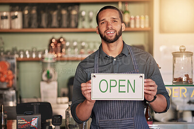 Buy stock photo Cafe, portrait or manager with open sign to welcome sales in a small business or coffee shop. Hospitality, restaurant or proud worker with a happy smile with message on board after opening a store