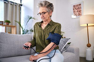 Buy stock photo Healthcare, machine and senior woman with hypertension, health monitor and test for blood pressure. Medicine, check and sick elderly person reading information on a device for a medical problem