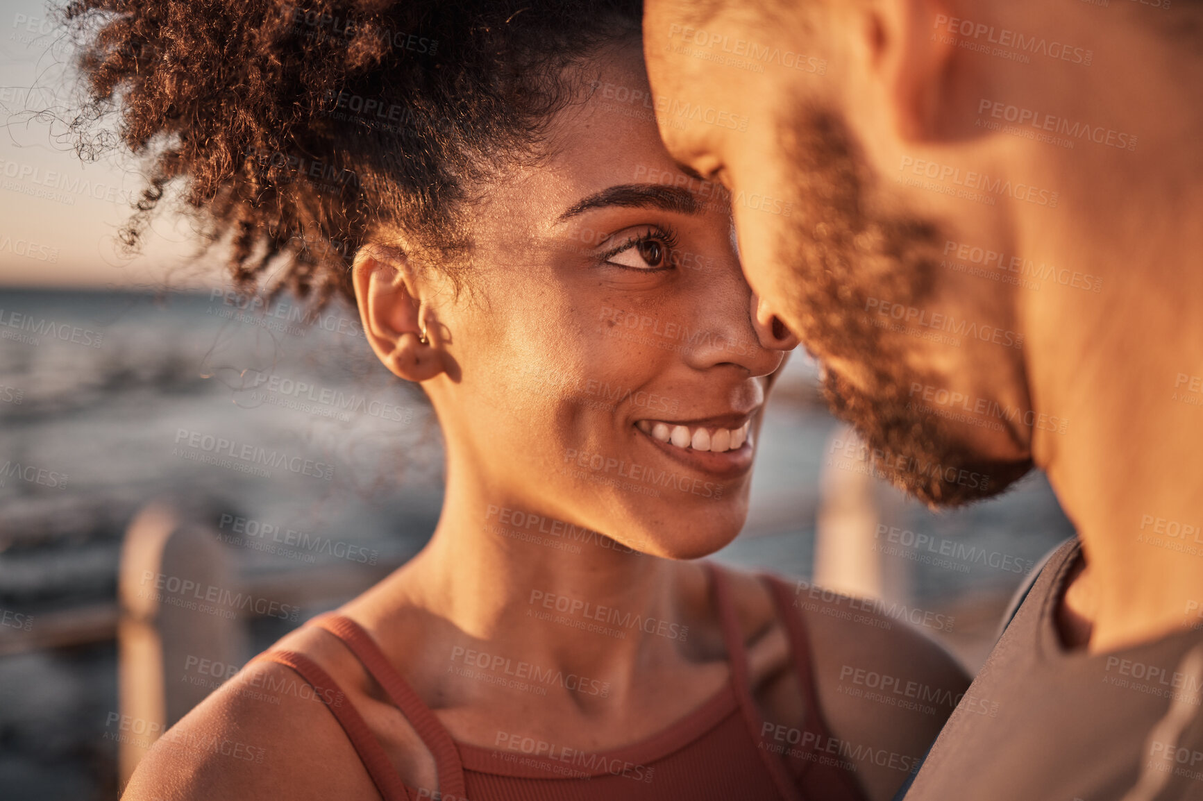 Buy stock photo Black couple, smile and hug with forehead embracing relationship, compassion or love and care by the beach. Happy man and woman touching heads smiling in happiness for support, trust or romance