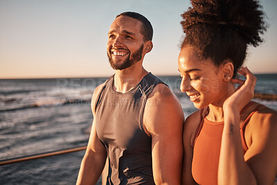 Buy stock photo Black couple, fitness and walking at the beach in conversation or talk together with smile for the outdoors. Happy man and woman enjoying fun sunset walk smiling for holiday break by the ocean coast