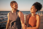 Black couple, fitness and walking at the beach with smile for conversation, talk or sunset together in the outdoors. Happy man and woman enjoying fun walk smiling for holiday break by the ocean coast