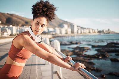 Buy stock photo Black woman, fitness rest and music on beach for exercise training, cardio wellness and workout outdoor. African girl, thinking and relax mindset or runner break with radio for health by ocean sea