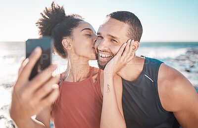 Buy stock photo Selfie kiss, fitness and couple with a phone for streaming, training and love at the beach in Bali. Gratitude, exercise and affectionate man and woman with a smile for a mobile photo after a workout