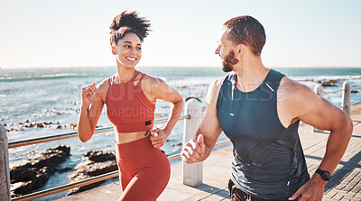 Buy stock photo Running, fitness and water with a sports couple outdoor during summer for cardio or endurance exercise. Health, training and ocean with a man and woman runner on a promenade for a workout together