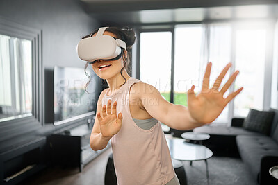 Buy stock photo VR, metaverse and futuristic with a woman in the living room of her home using a headset to access a 3d game. Technology, virtual reality and gaming with a female gamer using ai to play online games