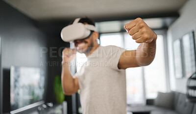 Buy stock photo VR, metaverse and man boxing on a game, training for a fight and match. Futuristic, digital sports and gamer punching while playing in an augmented reality with technology glasses in a house
