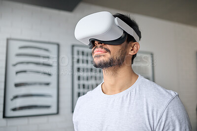 Buy stock photo Virtual reality glasses, technology and man in home with headset for streaming interactive, online and 3d games. Futuristic, digital tech and male relax with vr for metaverse, cyberspace and gaming
