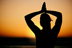Prayer hands, yoga and silhouette of woman at sunset outdoors for health and wellness. Pilates fitness, zen shadow and female yogi with namaste hand pose for chakra, training and meditation exercise.