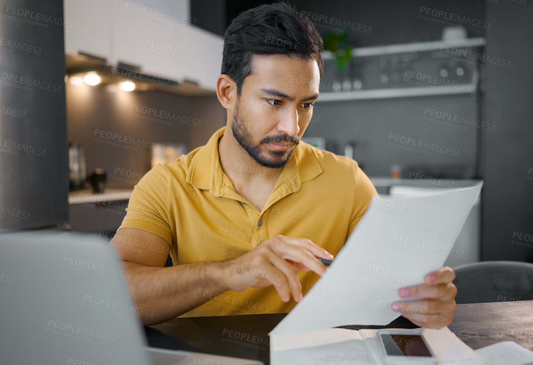 Buy stock photo Businessman, home office and documents by laptop in kitchen for focus, small business growth and opportunity. Digital entrepreneur, business owner and reading with contract, proposal and paperwork