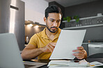 Budget, paperwork and Asian man planning with a laptop for finance, insurance and tax. Payment, note and Japanese entrepreneur reading information on a contract to start a small business from home