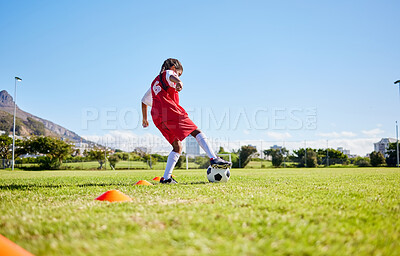 Buy stock photo Soccer girl child, field and training for fitness, sports and balance for control, speed and strong body from low angle. Female kid, fast football dribbling and exercise feet on grass in Cape Town