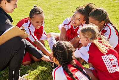 Buy stock photo Girl soccer group, sitting and planning with coach on field with smile, team building or motivation at training. Female kids, sports diversity or happy with friends, teamwork or strategy for football