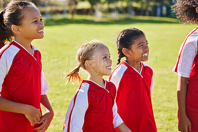 Buy stock photo Girl, soccer group and field with smile, team building or solidarity at sport training, strategy or motivation. Female kids, sports planning and diversity with teamwork, friends and focus in football