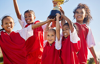 Buy stock photo Soccer, team and trophy with kids in celebration together as a girl winner group for a sports competition. Football, teamwork and award with sport player children celebrating success outdoor