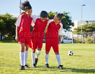 Buy stock photo Soccer, injury and children team help, support and walk with hurt friend during game at a sports field. Sport, accident and kids football group helping girl player after fitness, training and match