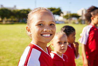 Buy stock photo Girl soccer player, portrait and field for training, teamwork and group diversity with smile. Young female kids, football group and happy for team building, learning and development with excited face