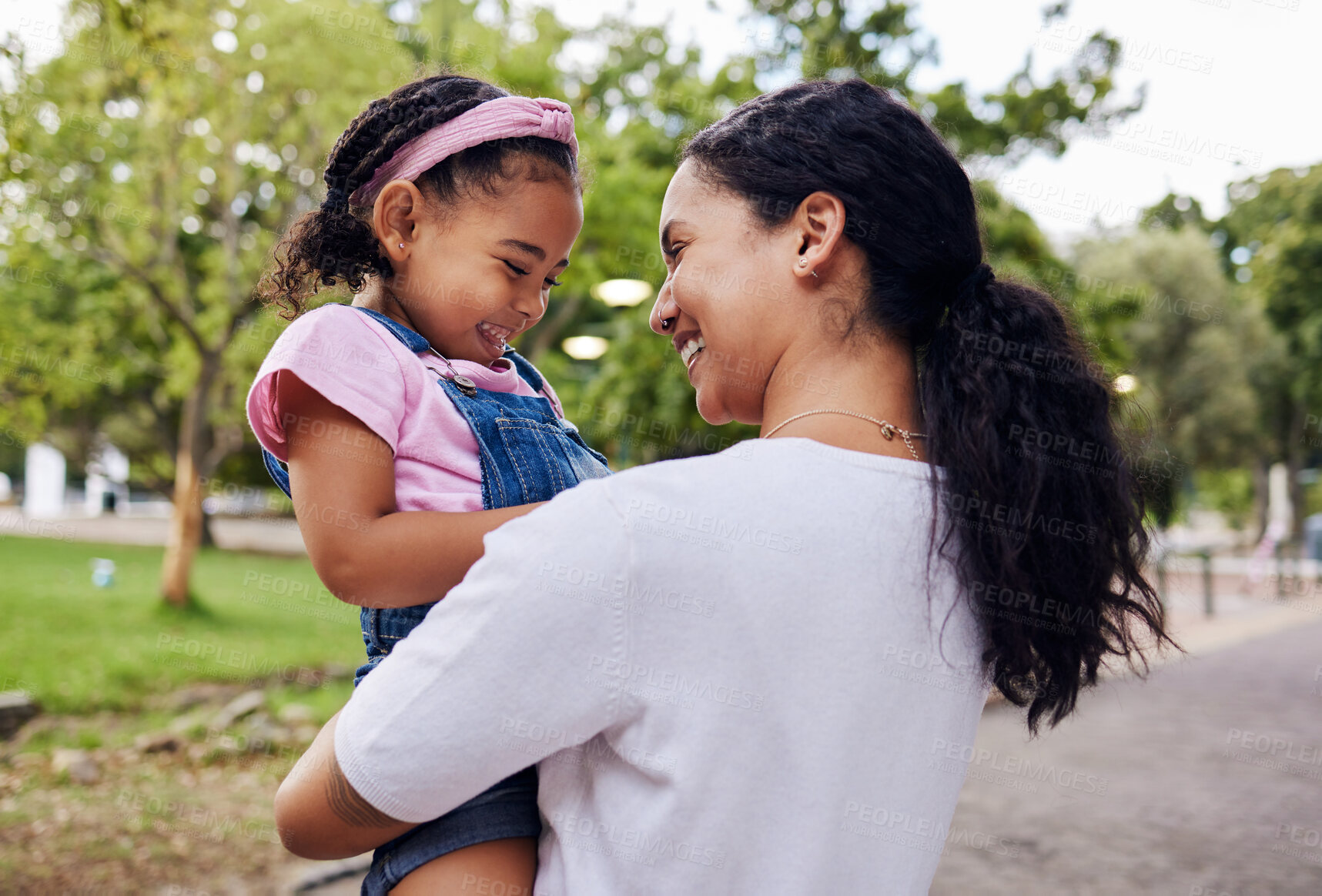 Buy stock photo Happy, family and mother with daughter in a park, laughing and playing while bonding outdoor together. Love, black woman and girl embracing in a forest, sweet and caring, relax and smile for joke